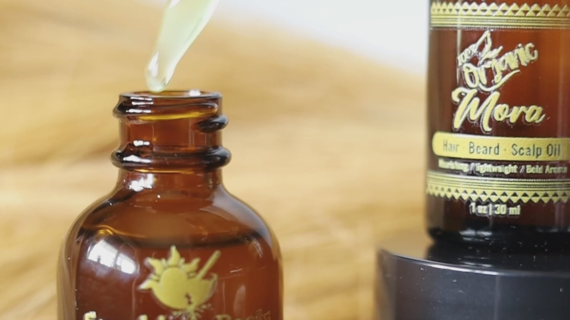Load video: A-List customer applies Sunshine Roots organic hair oil; simple, sensual routine for coils, curls, and beards.